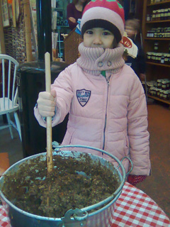 Making a wish while stirring the plum pudding